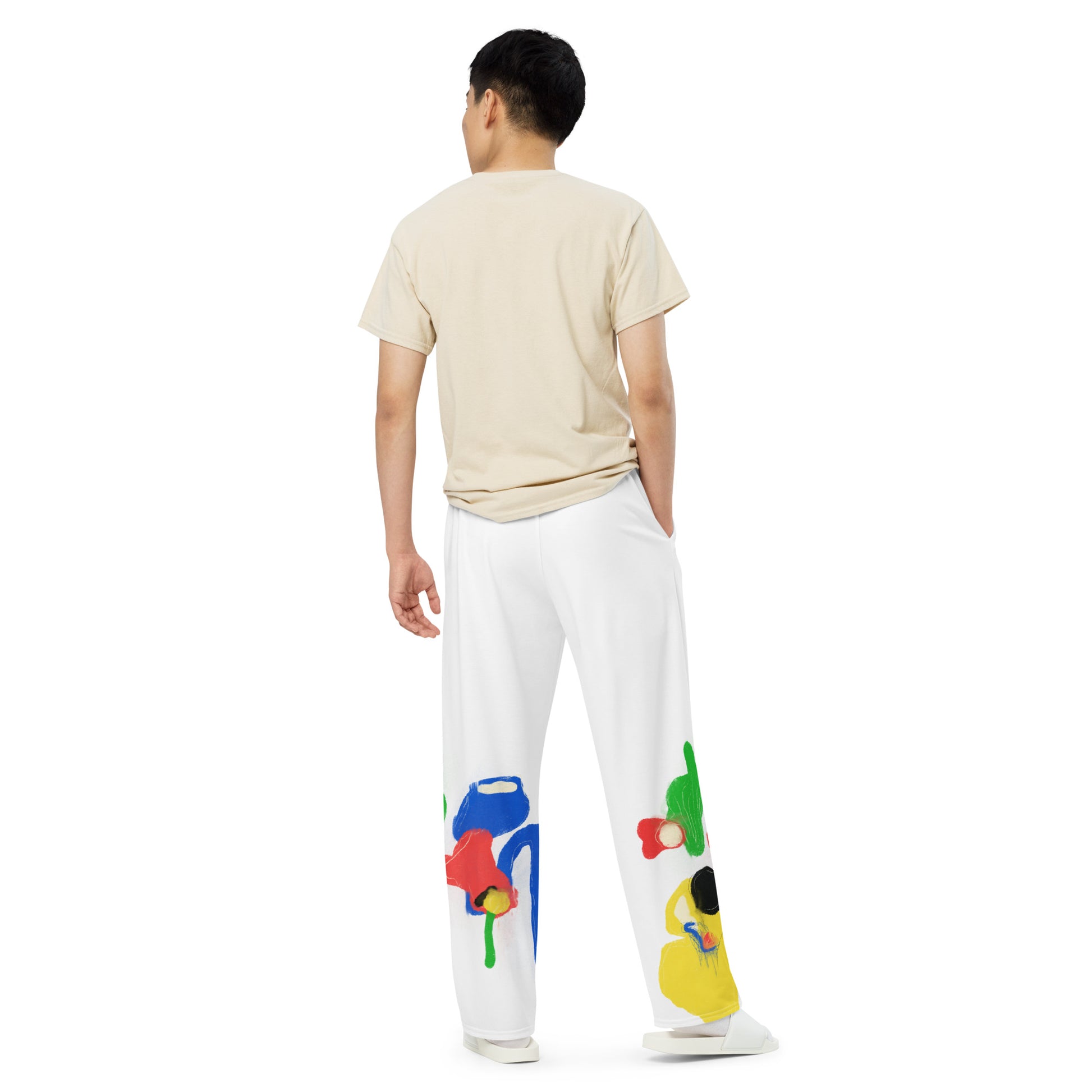 Unisex wide-leg pants with colorful abstract all-over print, featuring elastic waistband and relaxed fit.
