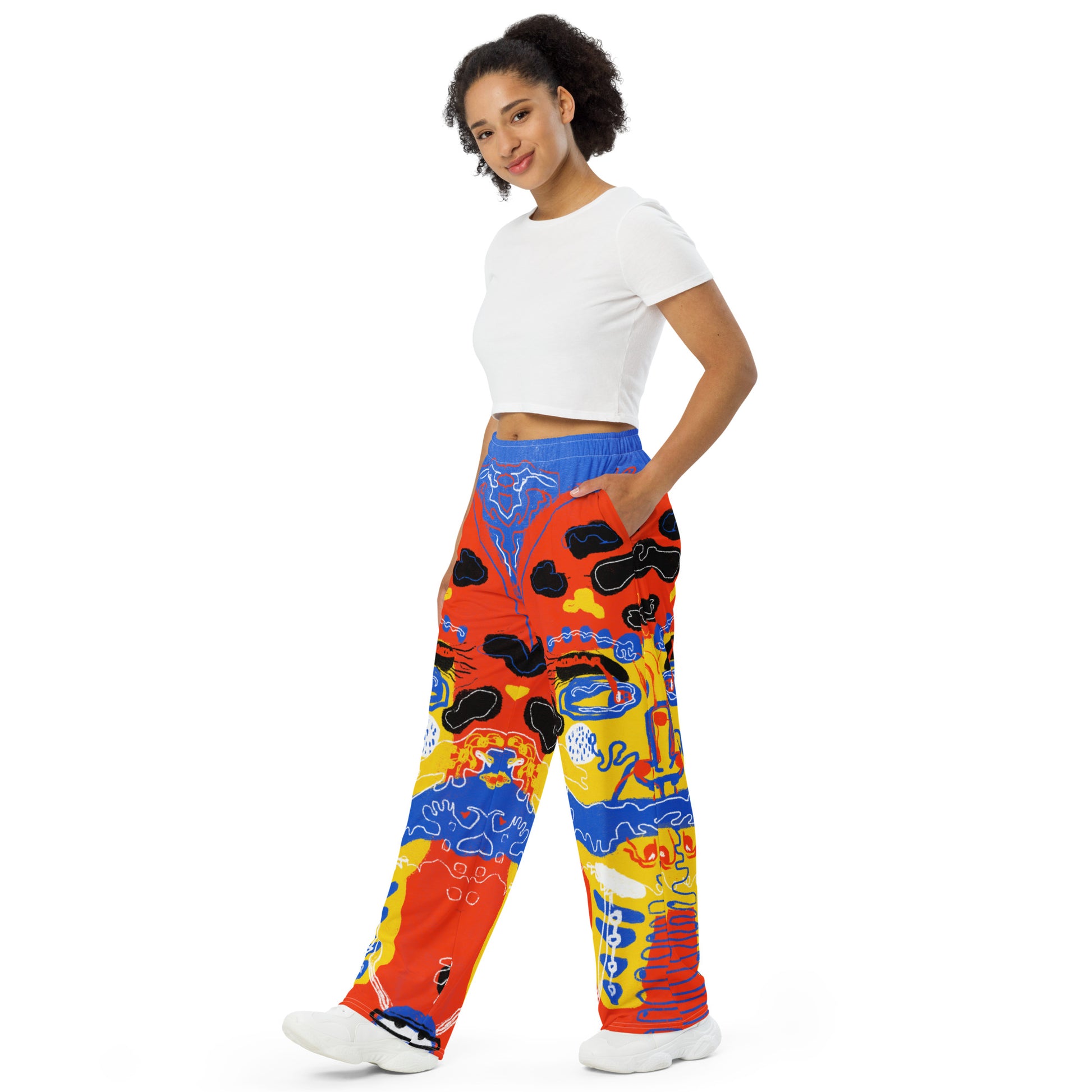 Relaxed fit wide-leg pants with a statement "Mushroom Lady" art print, showcasing oversized, surreal faces for a unique, bold style.