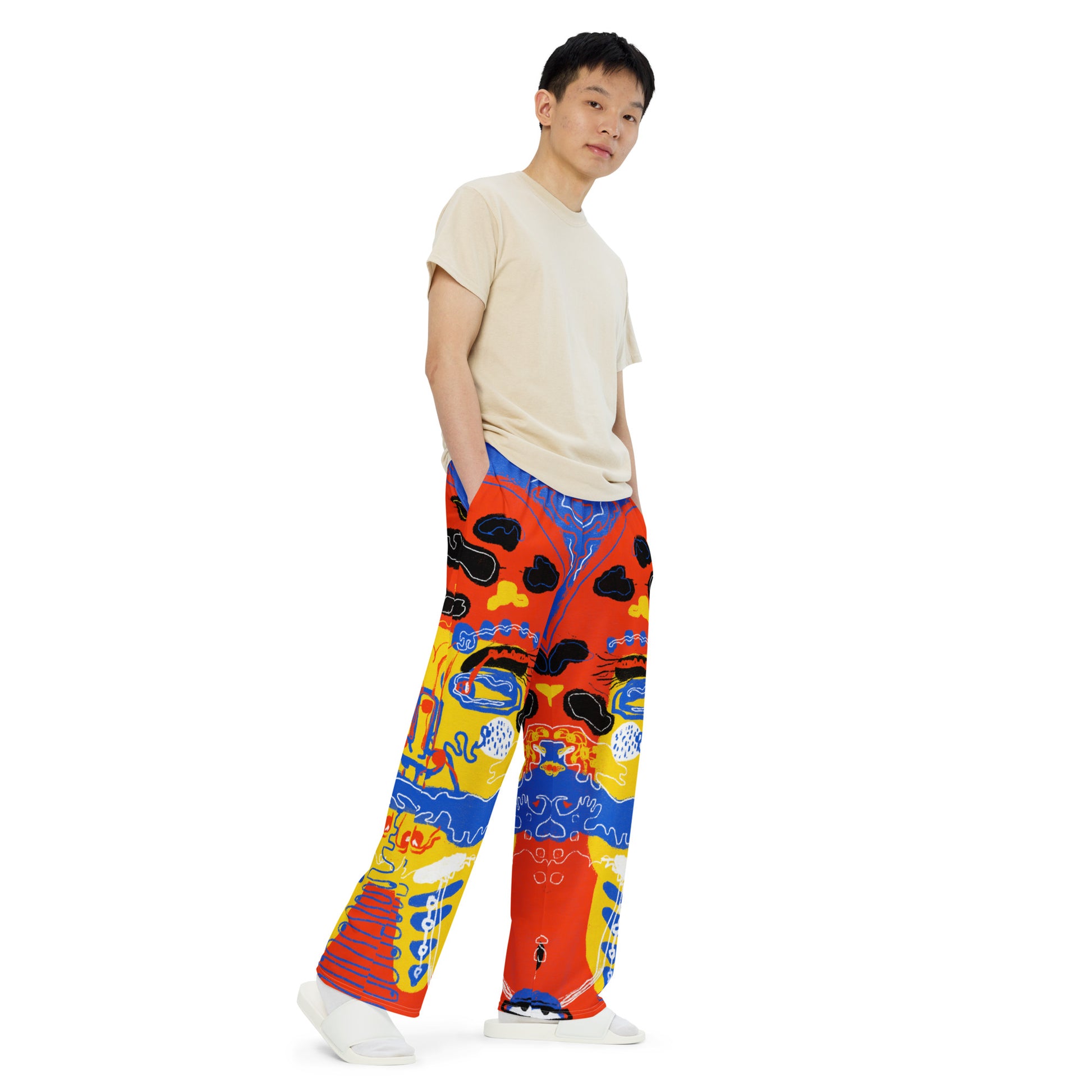 Relaxed fit wide-leg pants with a statement "Mushroom Lady" art print, showcasing oversized, surreal faces for a unique, bold style.