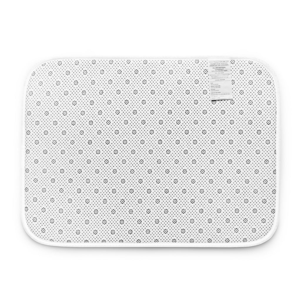 Comfortable "Dancing Hard" memory foam bath mat with an eye-catching chaotic print, designed for softness underfoot and secure non-slip placement.